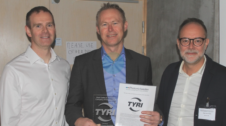 3 TYRI R&D team members stand together with the award for Best Optics and Photonics Company of the Year 2023'